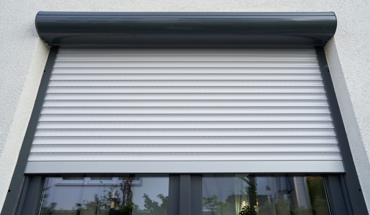 A picture of an aluminium glass window with blinds